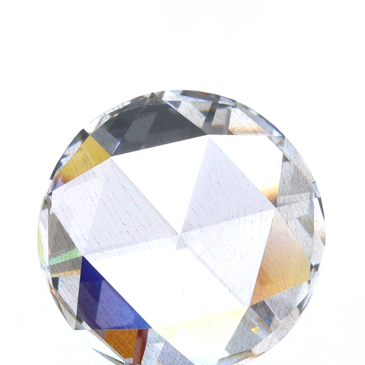 0.79ct round rose cut lab diamond with a unique brown hue and brilliant faceted surface.
